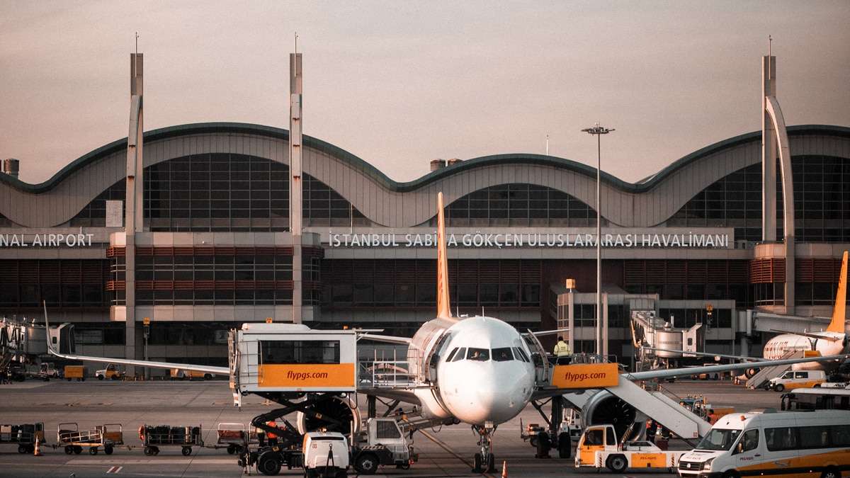 a plane parked in front of a building